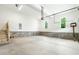 Clean and spacious two car garage with concrete flooring and natural light at 1218 Red Cedar Ct, Youngsville, NC 27596