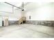 Clean and spacious garage, featuring concrete floors and stairs to the upper level at 1218 Red Cedar Ct, Youngsville, NC 27596