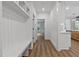 Hallway featuring a built-in bench and storage, leading into the home at 1218 Red Cedar Ct, Youngsville, NC 27596