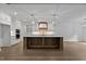 Bright kitchen with a large island, designer backsplash, and custom cabinetry at 1218 Red Cedar Ct, Youngsville, NC 27596