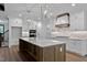 Gourmet kitchen featuring stainless appliances, large island, and custom cabinetry at 1218 Red Cedar Ct, Youngsville, NC 27596