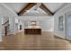 Open concept kitchen with hardwood floors, island, pendant lights, and stainless steel appliances at 1218 Red Cedar Ct, Youngsville, NC 27596