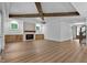 Bright living room with a cozy fireplace and lovely wood-beamed ceiling at 1218 Red Cedar Ct, Youngsville, NC 27596
