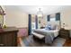 Comfortable bedroom featuring natural light and complemented by neutral walls and coordinated decor at 1305 Kimberly Dr, Raleigh, NC 27609