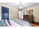 Well-lit bedroom with hardwood floors, ample natural light, and classic design elements at 1305 Kimberly Dr, Raleigh, NC 27609