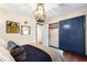 Charming bedroom features natural light, unique lighting fixture and a full-size closet at 1305 Kimberly Dr, Raleigh, NC 27609