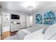 Bright bedroom showcasing a stylish dresser, closet, and modern lighting at 1305 Kimberly Dr, Raleigh, NC 27609