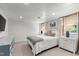 Bright bedroom featuring a comfortable bed, white trim, and plenty of natural light at 1305 Kimberly Dr, Raleigh, NC 27609
