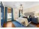 Inviting bedroom with ample natural light, hardwood floors, and decorative accents at 1305 Kimberly Dr, Raleigh, NC 27609