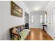 Welcoming foyer with hardwood floors, a vintage bench, and an elegant entryway at 1305 Kimberly Dr, Raleigh, NC 27609