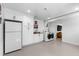 Functional laundry area with white cabinets, stainless steel appliances and utility sink at 1305 Kimberly Dr, Raleigh, NC 27609