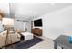 Inviting living room featuring stylish furnishings, barn door, and bright lighting at 1305 Kimberly Dr, Raleigh, NC 27609