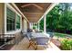 Covered outdoor patio with dining table and seating at 1305 Kimberly Dr, Raleigh, NC 27609