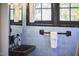 Charming bathroom with vintage blue tile and fixtures at 1307 Arnette Ave, Durham, NC 27707