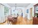 Spacious dining room showcasing hardwood floors, ample natural light, and an archway to the living room at 1307 Arnette Ave, Durham, NC 27707