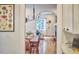 Inviting dining room featuring a table with seating, elegant lighting, and open access to the living room at 1307 Arnette Ave, Durham, NC 27707