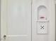 Hallway detail featuring a decorative niche with artwork and a framed design at 1307 Arnette Ave, Durham, NC 27707