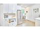 Well-lit kitchen with stainless steel appliances, ample cabinet space, and unique tiled floor at 1307 Arnette Ave, Durham, NC 27707