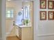 Charming kitchen area featuring a sink, window, and stylish decor with a view to the breakfast nook at 1307 Arnette Ave, Durham, NC 27707