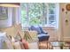 Comfortable living room with natural light, stylish furniture, and a serene view of the outdoors at 1307 Arnette Ave, Durham, NC 27707