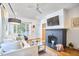 Cozy living room featuring a fireplace, large window, and comfortable seating, creating a relaxing atmosphere at 1307 Arnette Ave, Durham, NC 27707