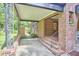 Covered side porch showcasing brick columns, providing a sheltered outdoor space at 1307 Arnette Ave, Durham, NC 27707