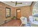 Inviting front porch features brick flooring and seating, perfect for enjoying the outdoors at 1307 Arnette Ave, Durham, NC 27707