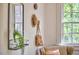 Sunroom with large windows providing natural light, terracotta floors, and neutral decor at 1307 Arnette Ave, Durham, NC 27707