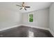 Bedroom with original hardwood floors, single window, and neutral wall paint at 1331 Sunset Ave, Rocky Mount, NC 27804