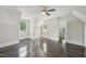 Bedroom with built-in storage, windows, and dark wood floors at 1331 Sunset Ave, Rocky Mount, NC 27804