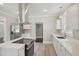 Bright kitchen with stainless steel appliances, quartz countertops, and island cooktop at 1331 Sunset Ave, Rocky Mount, NC 27804