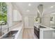 Bright kitchen boasts quartz countertops, island cooktop, and stainless sink at 1331 Sunset Ave, Rocky Mount, NC 27804