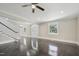 Bright, open-concept living area with gleaming floors, staircase, and large windows overlooking the yard at 1331 Sunset Ave, Rocky Mount, NC 27804