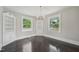 Cozy sitting area with hardwood floors, built-in shelving, and natural light from large windows at 1331 Sunset Ave, Rocky Mount, NC 27804