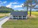 An aerial view of the home, showcasing its neat lawn, dark roof, and inviting front porch at 1347 Crocker Rd, Smithfield, NC 27577