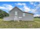 Exterior of barn featuring weathered wood siding, and a gable roof, surrounded by a green grassy field at 1347 Crocker Rd, Smithfield, NC 27577