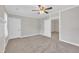 Bright bedroom featuring neutral walls, plush carpeting, ceiling fan and access to other rooms at 1347 Crocker Rd, Smithfield, NC 27577