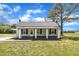 Charming home featuring a classic covered porch at 1347 Crocker Rd, Smithfield, NC 27577
