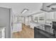 Eat-in kitchen offers stainless appliances, granite counters, wood flooring and access to multiple rooms at 1347 Crocker Rd, Smithfield, NC 27577