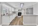 Bright eat-in kitchen features modern appliances, granite countertops, and wood-look flooring at 1347 Crocker Rd, Smithfield, NC 27577