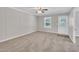 An inviting living room featuring neutral colors, a ceiling fan, and large windows at 1347 Crocker Rd, Smithfield, NC 27577