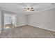 Spacious living room featuring neutral colors and seamless transitions to the kitchen at 1347 Crocker Rd, Smithfield, NC 27577