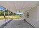 Covered back patio featuring a concrete floor, a white ceiling, and a view of the surrounding property at 1347 Crocker Rd, Smithfield, NC 27577
