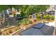 Backyard featuring a storage shed, patio area, and mature landscaping at 1437 Chelton Oaks Pl, Raleigh, NC 27614