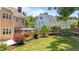 Backyard view with a gazebo, landscaped garden, and well-maintained lawn at 1437 Chelton Oaks Pl, Raleigh, NC 27614