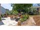 Backyard featuring a patio with an outdoor seating area, gazebo, and well-maintained landscaping at 1437 Chelton Oaks Pl, Raleigh, NC 27614