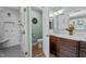 A light and bright bathroom featuring a glass shower, double sink vanity with tons of storage, and modern finishes at 1437 Chelton Oaks Pl, Raleigh, NC 27614