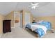 Comfortable bedroom with a ceiling fan, blue quilt on bed, and dresser for a relaxing and functional space at 1437 Chelton Oaks Pl, Raleigh, NC 27614