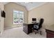 Well-lit home office includes large window, desk, and chair for creating a productive workspace at 1437 Chelton Oaks Pl, Raleigh, NC 27614
