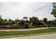 Fenced playground area with multiple play structures and walking path in a community park at 1437 Chelton Oaks Pl, Raleigh, NC 27614
